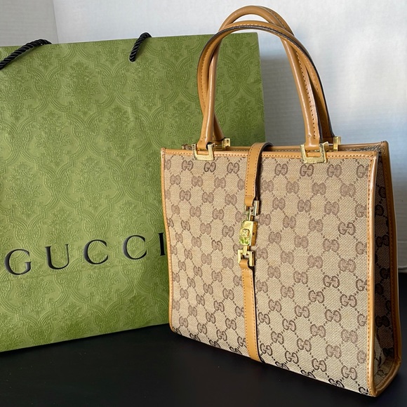 Gucci Handbags - Authentic GUCCI Jackie GG Canvas and Leather Tote Handbag.
